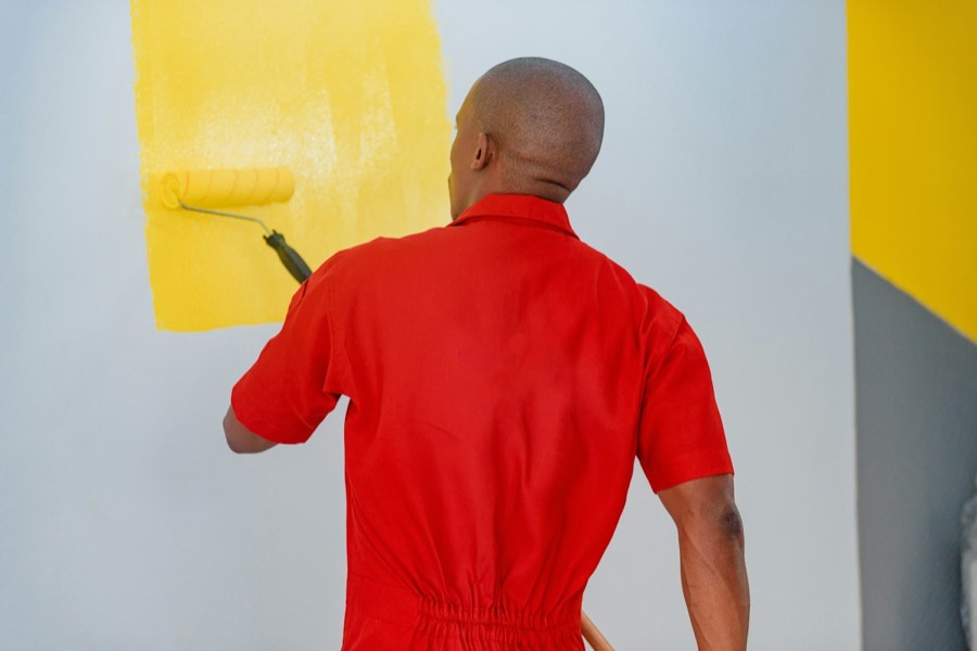 A wall being painted with a roller